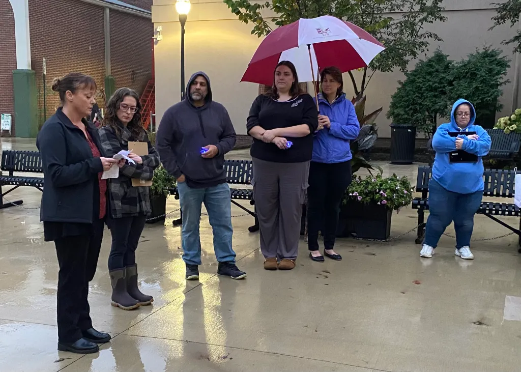 Domestic abuse survivor Shannon White, left, speaks Monday about her past experience at the Safe Voices vigil at Dufresne Plaza on Lisbon Street in Lewiston. October is Domestic Violence Awareness Month. Joe Charpentier/Sun Journal